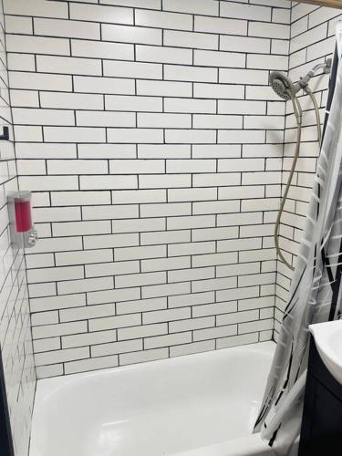 1850s historic Row House 7min train to NYC with private backyard