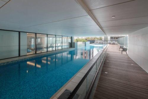 Swimming pool, 1 Bedroom Apartment @ Mason Square in Essendon