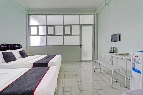 Capital O 91466 Hotel Neu Backpacker Tf Syariah (smk Tb)