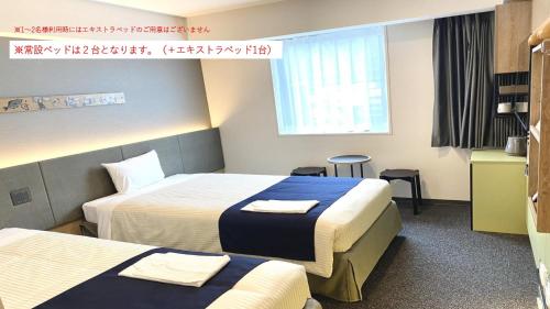 Deluxe Twin Room with Extra Bed image 6