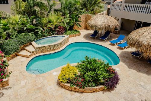 Stunning Modern 2-Bedroom Apartment With Tropical Garden, Pool And Jacuzzi, Palm Eagle Beach