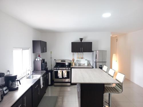 Kitchen, W's Hostel in Merced