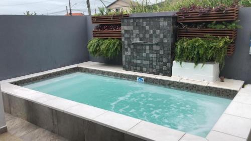 Swimming pool, Casa de Ferias com Piscina em Bombinhas in Sertaozinho