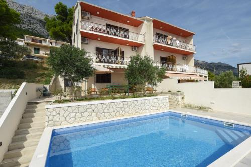  Seaside apartments with a swimming pool Marusici, Omis - 10009 in Mimice