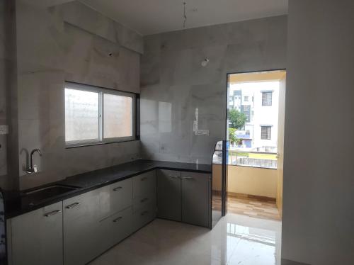 keuken, 850m² 1 slaapkamer, 1 privé badkamer Appartement in Kamatwade (Shiv-Vatsalya Homestay) in Kamatwade