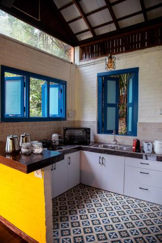 a kitchen with a sink, stove, and cabinets, The Dusun in Pantai