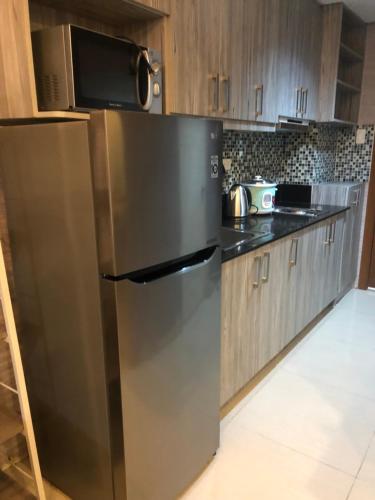 Kitchen, Shell Residence MOA Manila by JO Alano near SM Mall of Asia