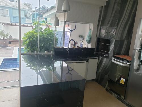 Casa de condominio em frente ao shopping Recreio near Bar Summer Drink's.