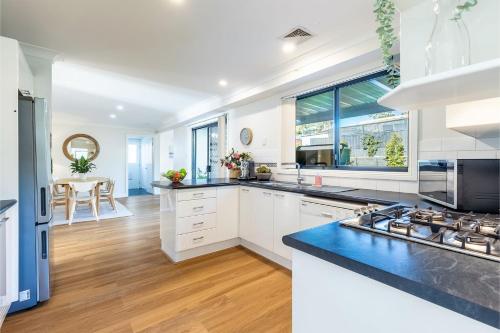 Kitchen, Akoya House 122 Tomaree Rd Pet friendly linen air conditioning WiFi and boat parking in Shoal Bay