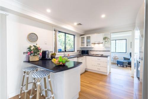 Kitchen, Akoya House 122 Tomaree Rd Pet friendly linen air conditioning WiFi and boat parking in Shoal Bay