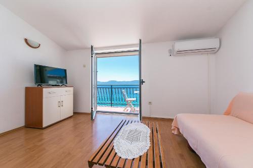 One-Bedroom Apartment with Balcony and Sea View