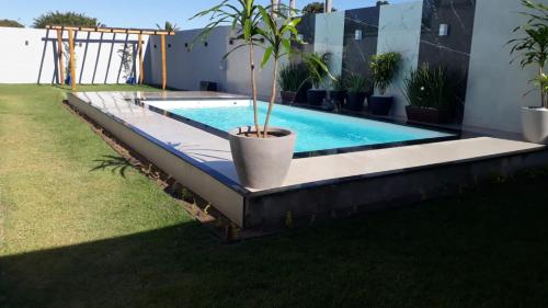 泳池, Casa por do sol in 庫穆魯薩迪巴