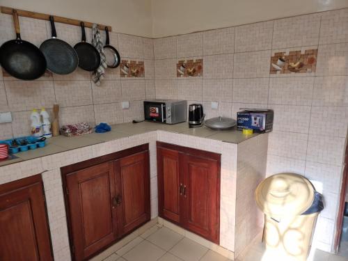 Cocina, CHAMBRES PRIVEES CLIMATISEES-DOUCHES PERSONNELLES-NEFLIX-SALON in Dakar