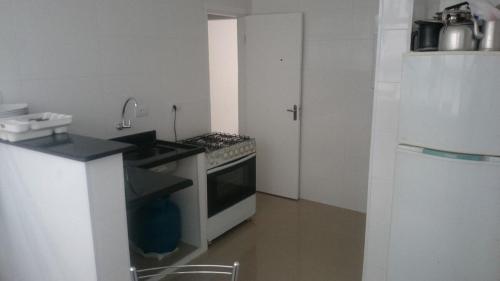 Kitchen, Apartamentos Enseada Guaruja in Vila Julia