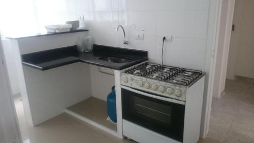 Kitchen, Apartamentos Enseada Guaruja in Vila Julia