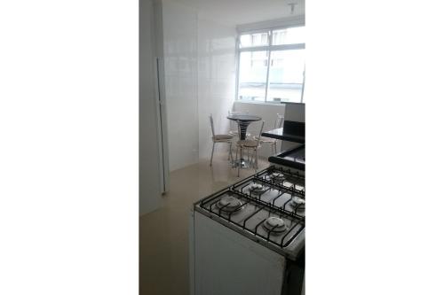 Kitchen, Apartamentos Enseada Guaruja in Vila Julia