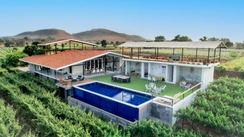 SaffronStays Onellaa, Nashik - infinity pool villa surrounded by a vineyard