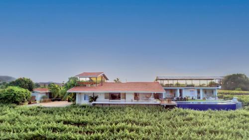 SaffronStays Onellaa, Nashik - infinity pool villa surrounded by a vineyard