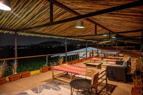 SaffronStays Onellaa, Nashik - infinity pool villa surrounded by a vineyard