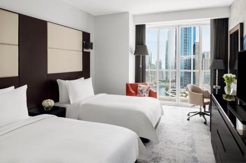 Movenpick Jumeirah Lakes Towers Room Type - Superior Twin Room with Lake View - Includes daily access to Riva Beach Club with free shuttle servi Movenpick Jumeirah Lakes Towers Room Type - Superior Twin Room with Lake View - Includes daily access to Riva Beach Club with free shuttle servi