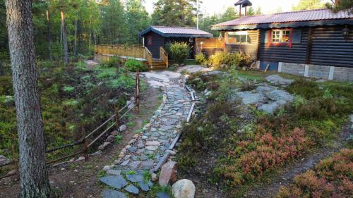 Timber cottages with jacuzzi and sauna near lake Vänern