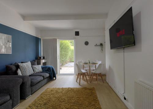 Shared lounge/TV area, Ryland House | Sleeps 8 | M6 Access & Garden in Perry Common