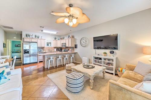 Sunny Townhome with Pool Access about 1 Mi to Beach Sunny Townhome with Pool Access about 1 Mi to Beach