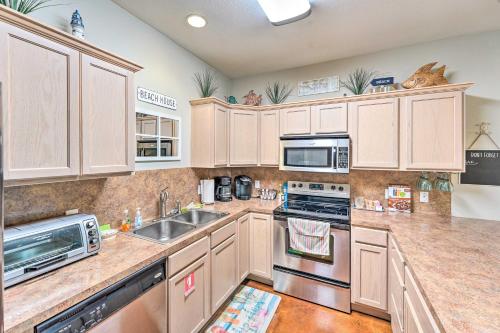 Sunny Townhome with Pool Access about 1 Mi to Beach Sunny Townhome with Pool Access about 1 Mi to Beach