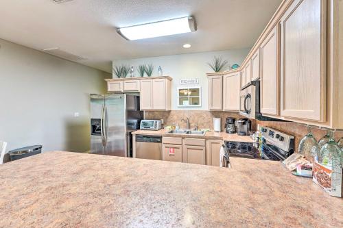 Sunny Townhome with Pool Access about 1 Mi to Beach Sunny Townhome with Pool Access about 1 Mi to Beach