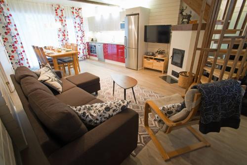 Közös társalgó / TV, Vuokatinmaa Holiday Apartments in Sotkamo