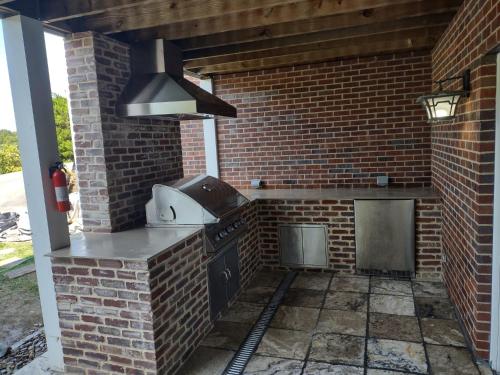 Smokie Mountain Lake House on Douglas Lake - 11 bedrooms, 6 bathrooms sleeping 30 - Lakefront, Secluded, Private, Gated, Personal Boat Dock, Hot Tub , Theater Room, Games Room, Hot Tub, Indoor & Outdoor Kitchens in Sevierville, USA
