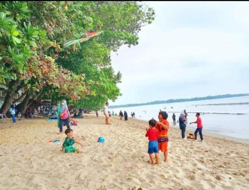 KONDOMINIUM CARITA BEACH-YUNNI