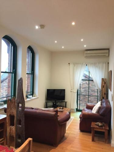 converted chapel filey floor to ceiling arch window - Tap to explore photos