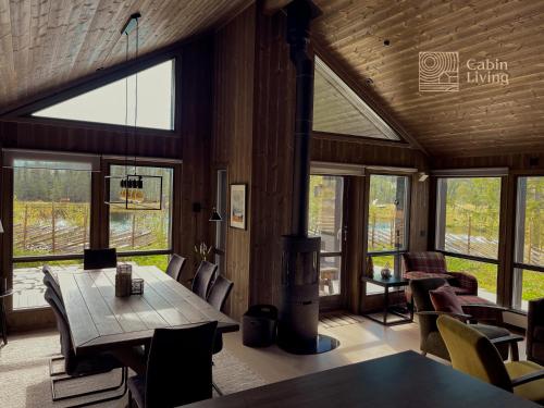 Unique cabin with fantastic lake view, sauna, ski & EV outlet in สวิงวูลล์
