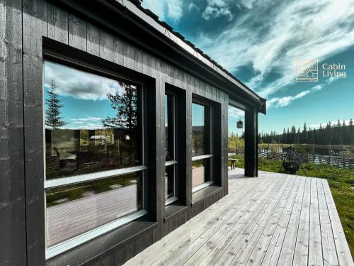 Unique cabin with fantastic lake view, sauna, ski & EV outlet in สวิงวูลล์