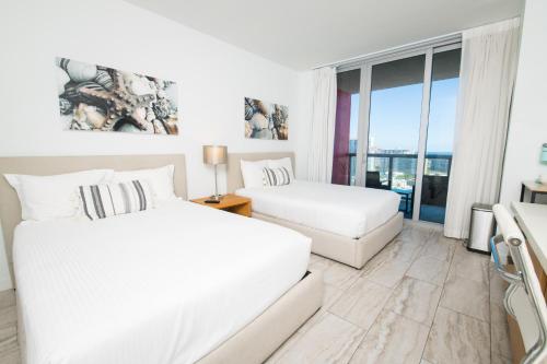 2409AB Stylish Breathtaking 2BR 2BTH Condo ideal for long stays by the beach