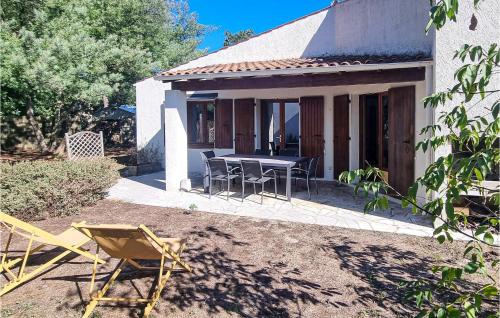 Nice home in Le Grand-Village-Plage with WiFi and 4 Bedrooms