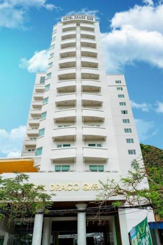 a tall building with a large window, Draco QK3 Hotel in Cat Ba Island