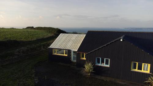 Funky, family-friendly five bed beach house on cliff looking over Tenby, Pendine, Pembrokeshire