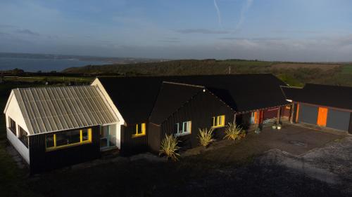 Funky, family-friendly five bed beach house on cliff looking over Tenby, Pendine, Pembrokeshire