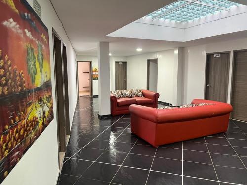 Shared lounge/TV area, Hotel Playa Blanca in Cuitiva