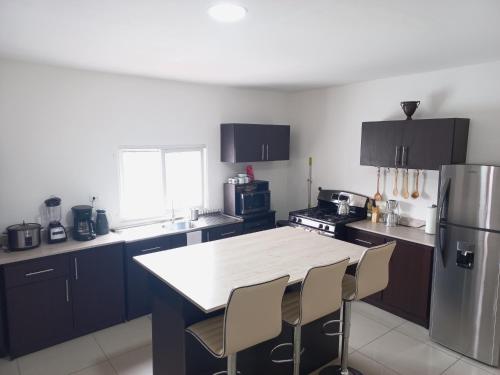 Kitchen, W's Hostel in Merced