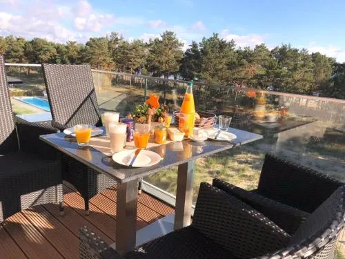 Avella "Sundowner" mit Meerblick, Innenpool und eigener Wallbox in Binz, Deutschland