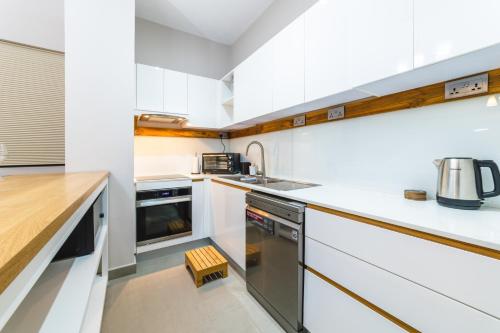 One Bay Residence Unit 15 - Penthouse with private roof top, jacuzzi and sea view - Tap to explore photos