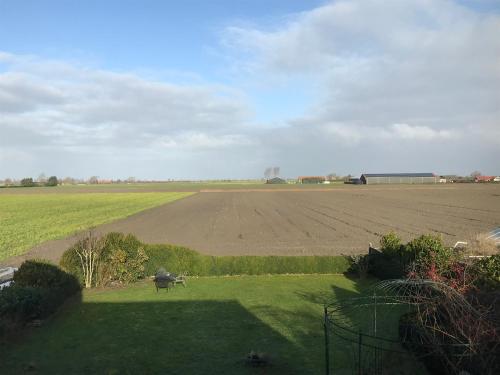  T Huuske tuinappartement met fantastisch uitzicht, nabij Zee in Zonnemaire