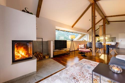 der Sonnberg Alpinlodges - Apartments mit Seeblick, privater Sauna und Self Check-In in Zell Am See