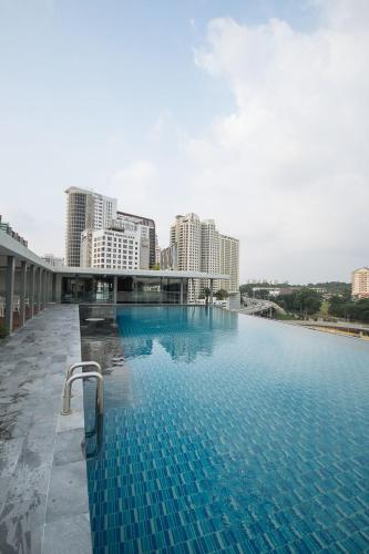 a large swimming pool in a large city, The Signature Hotel & Serviced Suites Kuala Lumpur in Kuala Lumpur