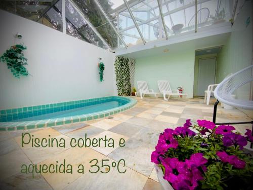 Swimming pool, Pousada Parque das Flores in Campos Do Jordao