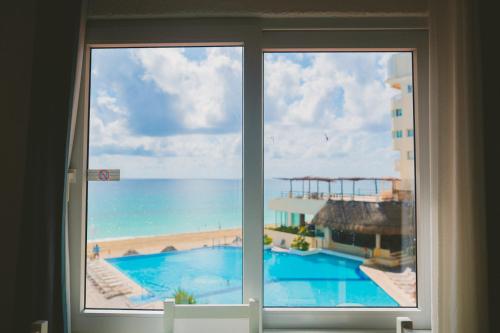 Cancun Plaza Condo Ocean front - Tap to explore photos