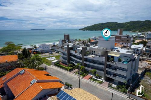ทัศนียภาพภายนอกโรงแรม, Apartamento com 03 dormitórios meia quadra do mar (Apartamento com 03 dormitorios meia quadra do mar) in มอร์รินโยส